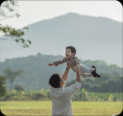 Dad lifting up his child